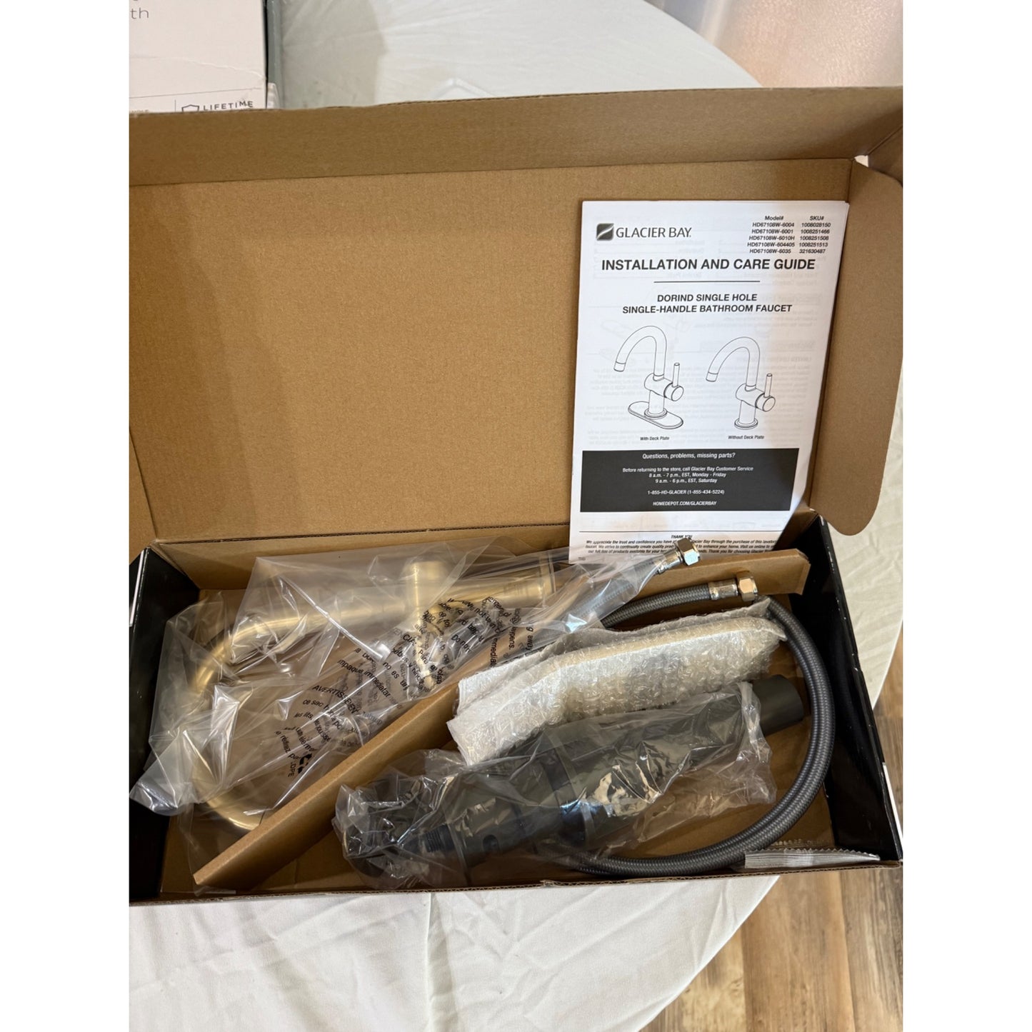 Glacier Bay Dorind Single Hole Single-Handle Deck Mount High-Arc Bathroom Faucet in Matte Gold